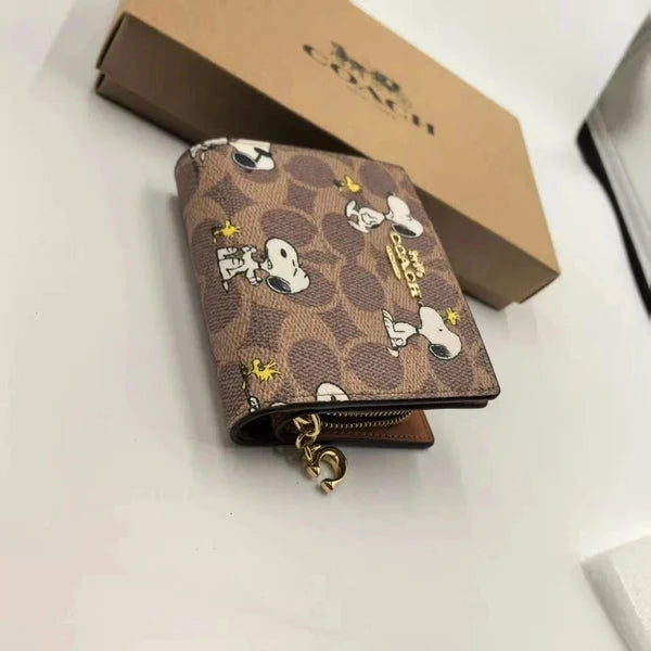 COACH X PEANUTS - Limited Edition Snoopy & Woodstock Small Zip Wallet | COACH New York Signature Canvas